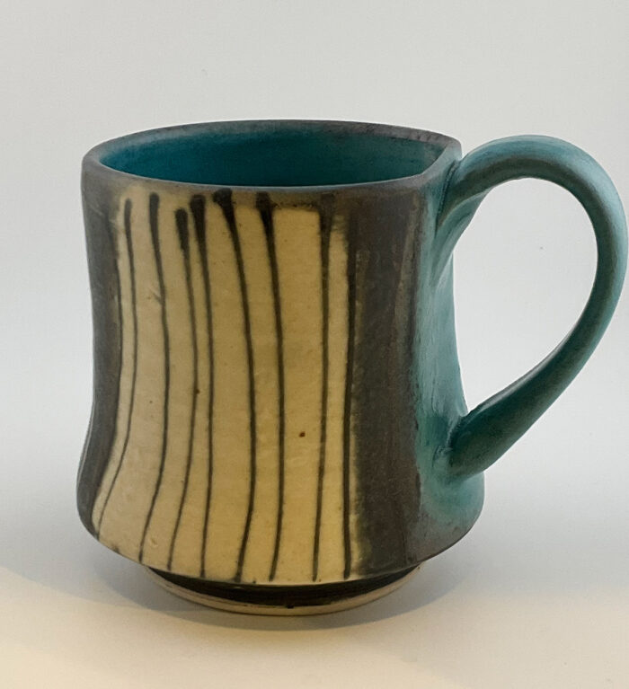 Deloris Fortuns, Black and white striped mug with turquoise interior and handle